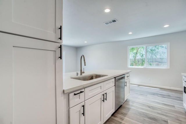 5276 N 1st St, Fresno, CA 93710 - kitchen featuring stainless steel dishwasher, light countertops, white cabinets, recessed lighting, and light wood-type flooring