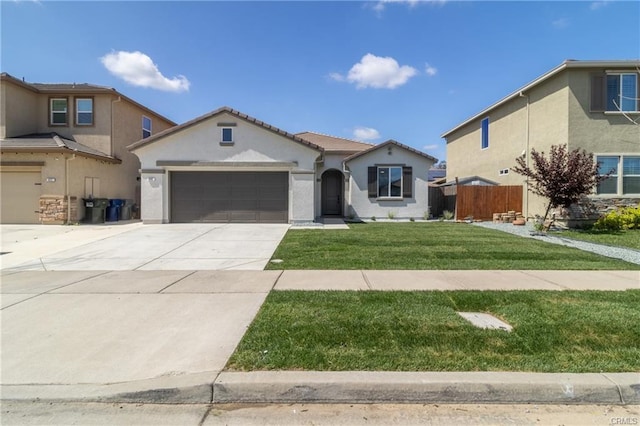 405 Denise Dr, Merced, CA 95341 - view of front facade with stucco siding, a garage, and driveway