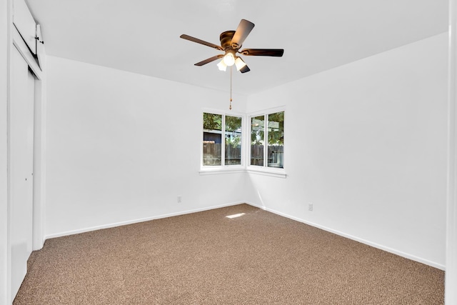 4759 E Vassar Ave, Fresno, CA 93703 - unfurnished bedroom featuring dark carpet, a closet, and a ceiling fan