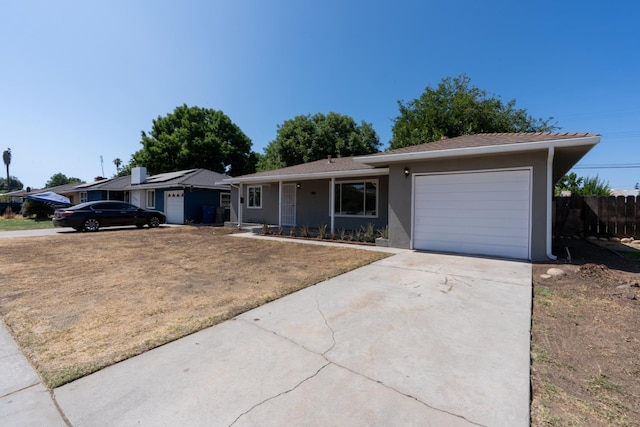 4759 E Vassar Ave, Fresno, CA 93703 - single story home featuring a garage, driveway, and stucco siding