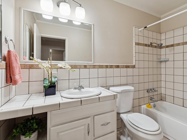 3672 N Shirley Ave, Fresno, CA 93727 - bathroom featuring vanity, ornamental molding, bathtub / shower combination, and tile walls