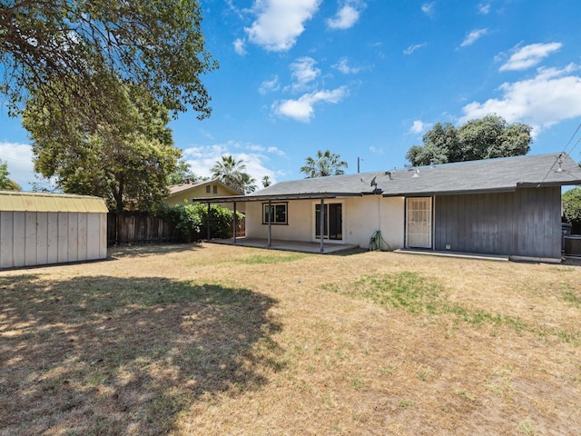 3672 N Shirley Ave, Fresno, CA 93727 - rear view of property with a storage shed and a patio area