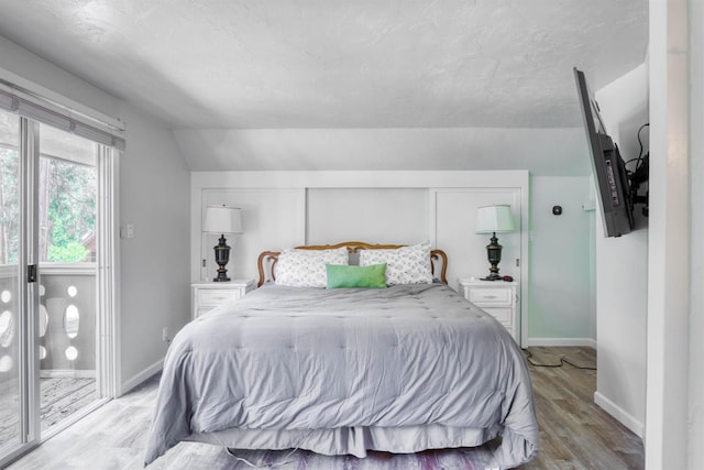 42198 Smoke Tree, Shaver Lake, CA 93664 - bedroom with light wood-style flooring and vaulted ceiling
