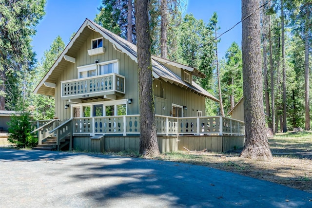42198 Smoke Tree, Shaver Lake, CA 93664 - view of front of house with a wooden deck and a balcony