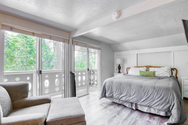 42198 Smoke Tree, Shaver Lake, CA 93664 - bedroom with wood finished floors, access to outside, and a textured ceiling