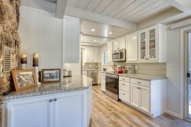 42198 Smoke Tree, Shaver Lake, CA 93664 - kitchen with appliances with stainless steel finishes, light wood finished floors, backsplash, beam ceiling, and recessed lighting