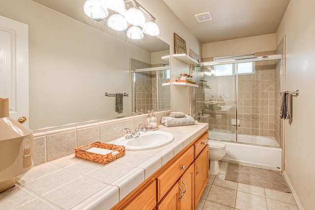 42052 Granite Ridge Rd, Shaver Lake, CA 93664 - bathroom with vanity, tile patterned floors, and bath / shower combo with glass door