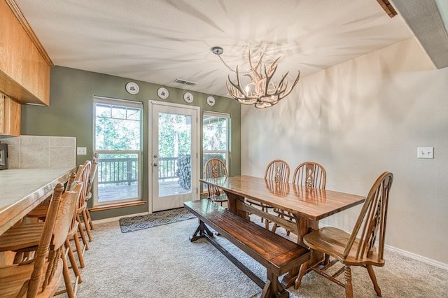 42052 Granite Ridge Rd, Shaver Lake, CA 93664 - dining area featuring light colored carpet and a chandelier