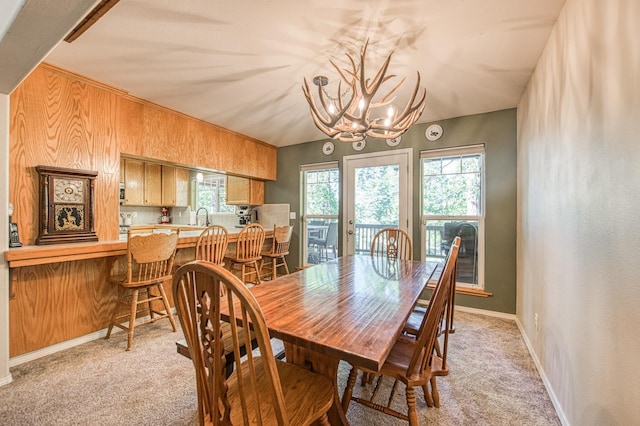 42052 Granite Ridge Rd, Shaver Lake, CA 93664 - dining space with light colored carpet and a chandelier
