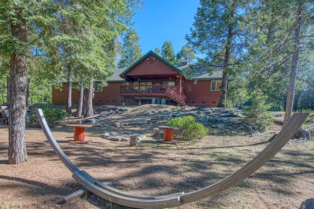 42052 Granite Ridge Rd, Shaver Lake, CA 93664 - back of property featuring crawl space, a deck, a chimney, and stairs