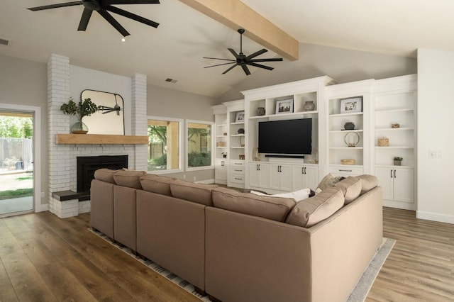 7671 N Ricewood Ave, Fresno, CA 93711 - living area with ceiling fan, wood finished floors, and a brick fireplace
