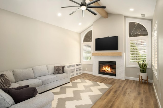 7671 N Ricewood Ave, Fresno, CA 93711 - living room featuring a ceiling fan, a glass covered fireplace, wood finished floors, and recessed lighting