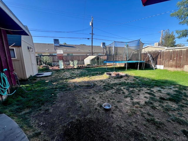 420 E Florinda St, Hanford, CA 93230 - fenced backyard with a trampoline and a shed