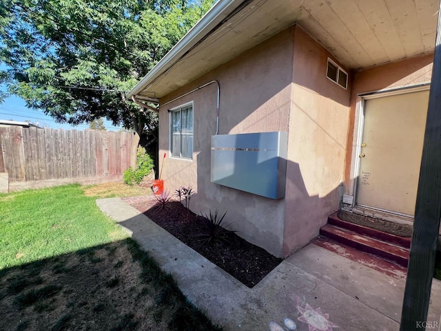 420 E Florinda St, Hanford, CA 93230 - doorway to property featuring stucco siding