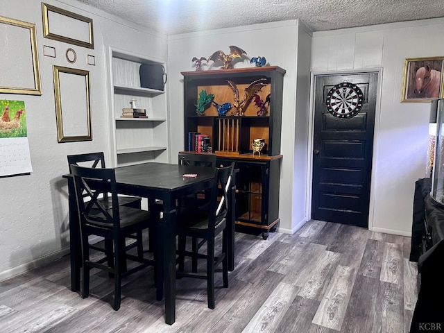 420 E Florinda St, Hanford, CA 93230 - dining area featuring wood finished floors and a textured ceiling