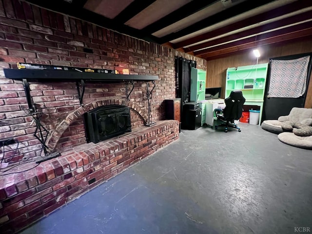 420 E Florinda St, Hanford, CA 93230 - living area with a wood stove, concrete floors, and brick wall