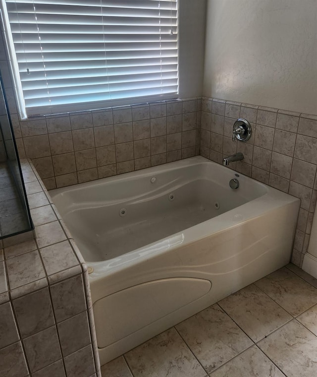 3310 N Jason Ave, Fresno, CA 93737 - full bathroom with a tub with jets, plenty of natural light, and tile patterned flooring