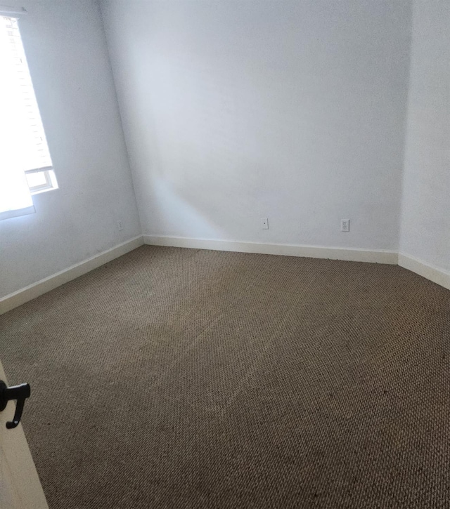 3310 N Jason Ave, Fresno, CA 93737 - carpeted spare room featuring baseboards