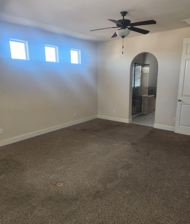 3310 N Jason Ave, Fresno, CA 93737 - carpeted spare room featuring a ceiling fan and arched walkways