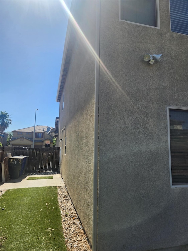 3310 N Jason Ave, Fresno, CA 93737 - view of property exterior with stucco siding and a patio