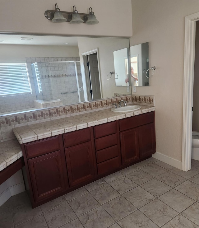 3310 N Jason Ave, Fresno, CA 93737 - full bath featuring double vanity, tile patterned flooring, and a tile shower