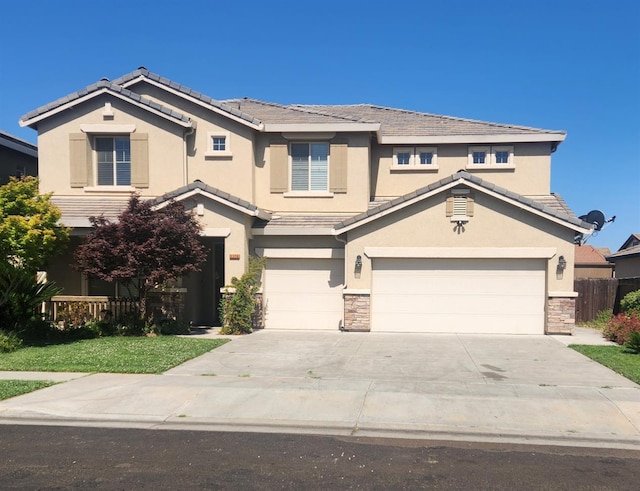 3310 N Jason Ave, Fresno, CA 93737 - traditional-style house with stucco siding, stone siding, and concrete driveway
