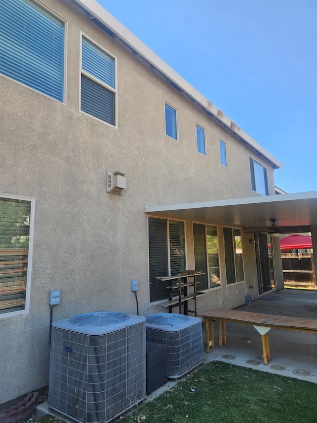 3310 N Jason Ave, Fresno, CA 93737 - rear view of property with stucco siding, ceiling fan, and a patio
