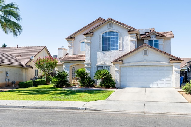 2322 E Revere Rd, Fresno, CA 93720 - view of front of home featuring concrete driveway, a tiled roof, stucco siding, and a front yard