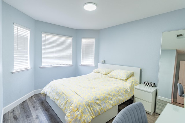2322 E Revere Rd, Fresno, CA 93720 - bedroom with light wood finished floors and multiple windows
