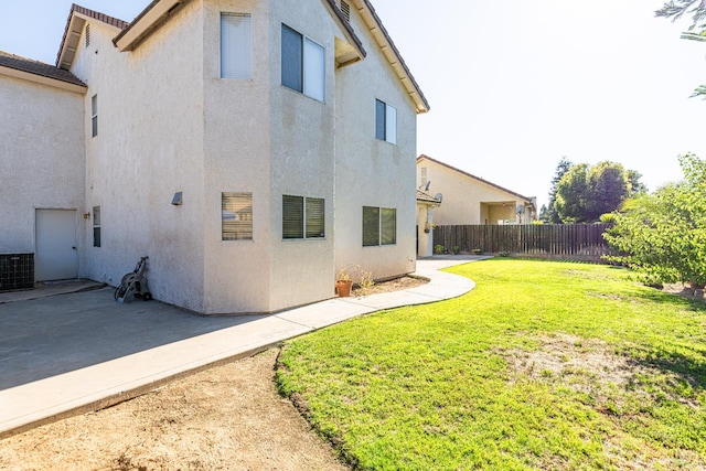2322 E Revere Rd, Fresno, CA 93720 - rear view of property featuring stucco siding, a fenced backyard, and a patio