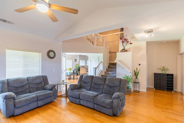 2322 E Revere Rd, Fresno, CA 93720 - living room featuring light wood-style floors, stairs, a ceiling fan, and high vaulted ceiling