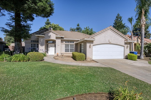 7515 N Wheeler Ave, Fresno, CA 93722 - ranch-style house with a garage, a tiled roof, stucco siding, a front yard, and driveway