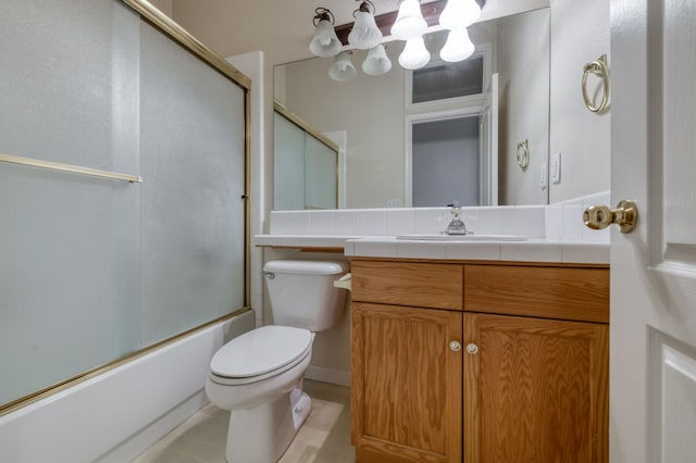 7515 N Wheeler Ave, Fresno, CA 93722 - bathroom with vanity, bath / shower combo with glass door, and tile patterned floors