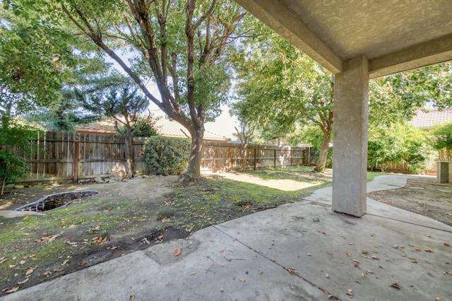 7515 N Wheeler Ave, Fresno, CA 93722 - fenced backyard featuring a patio