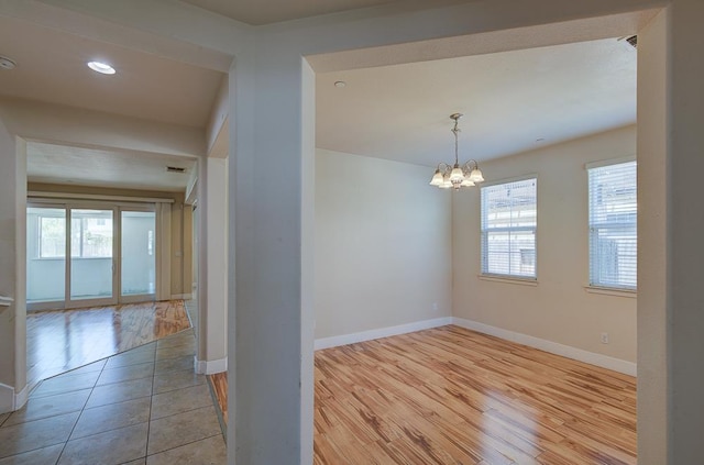 3669 N Clover Ave, Fresno, CA 93727 - empty room with wood finished floors, a chandelier, and recessed lighting