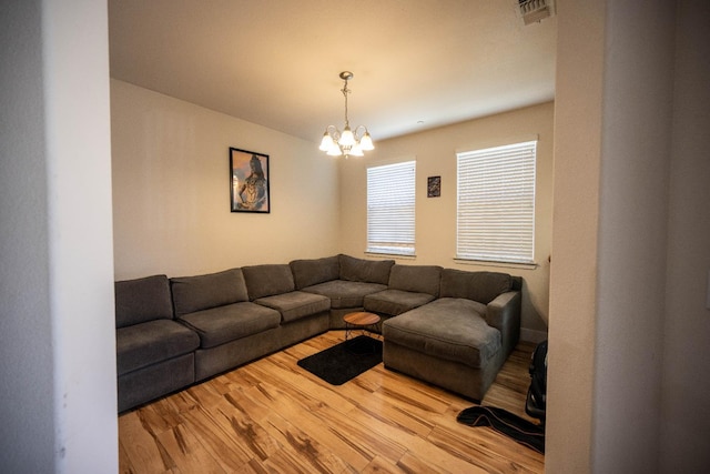 3669 N Clover Ave, Fresno, CA 93727 - living area with a chandelier and wood finished floors