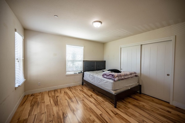 3669 N Clover Ave, Fresno, CA 93727 - bedroom with light wood finished floors and a closet