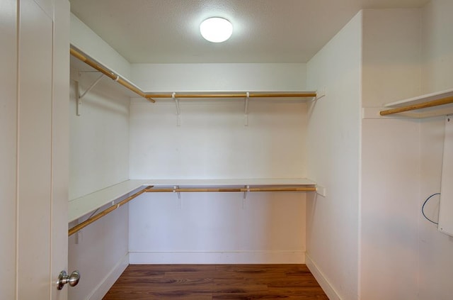 3669 N Clover Ave, Fresno, CA 93727 - walk in closet with dark wood finished floors