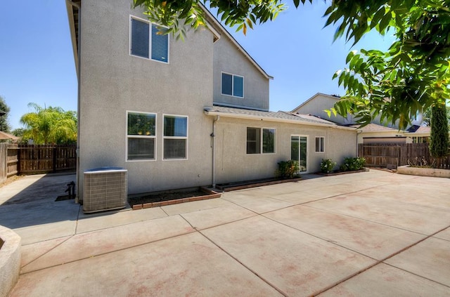 3669 N Clover Ave, Fresno, CA 93727 - rear view of property featuring a patio area, a fenced backyard, and stucco siding