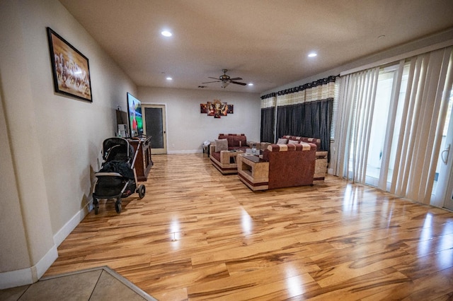 3669 N Clover Ave, Fresno, CA 93727 - living room with light wood finished floors, recessed lighting, and a ceiling fan