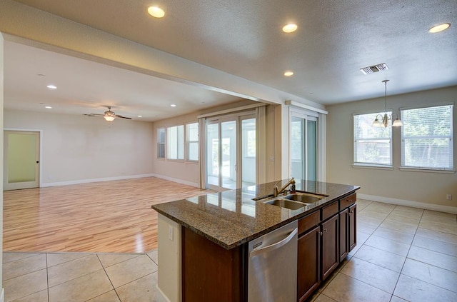 3669 N Clover Ave, Fresno, CA 93727 - kitchen featuring stainless steel dishwasher, ceiling fan, light tile patterned floors, recessed lighting, and dark stone counters