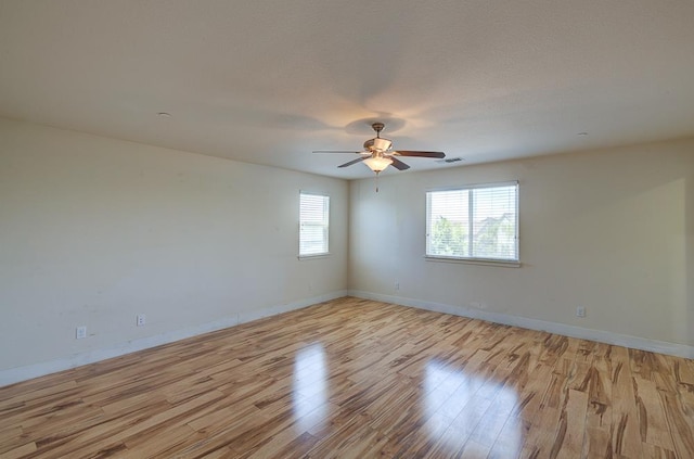 3669 N Clover Ave, Fresno, CA 93727 - empty room featuring light wood-style floors and a ceiling fan