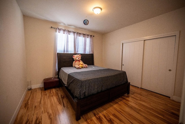 3669 N Clover Ave, Fresno, CA 93727 - bedroom with wood finished floors and a closet