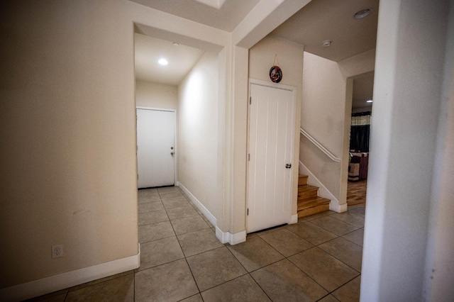 3669 N Clover Ave, Fresno, CA 93727 - hallway featuring light tile patterned flooring, stairway, and recessed lighting