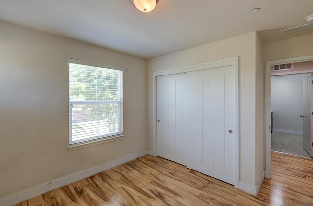 3669 N Clover Ave, Fresno, CA 93727 - unfurnished bedroom featuring light wood-type flooring and a closet