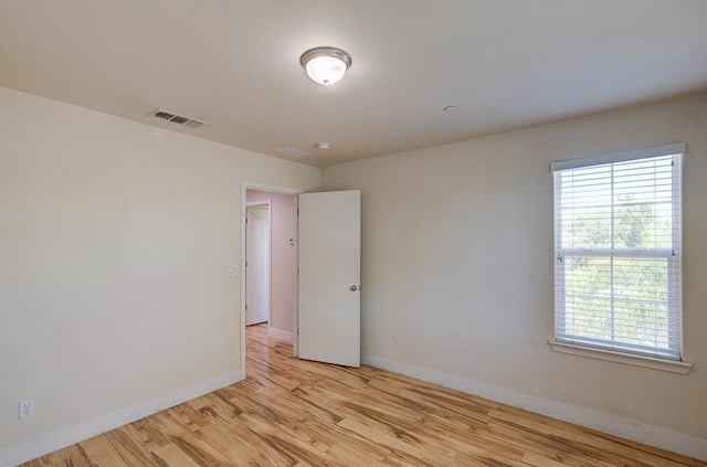 3669 N Clover Ave, Fresno, CA 93727 - empty room featuring baseboards and light wood-style floors