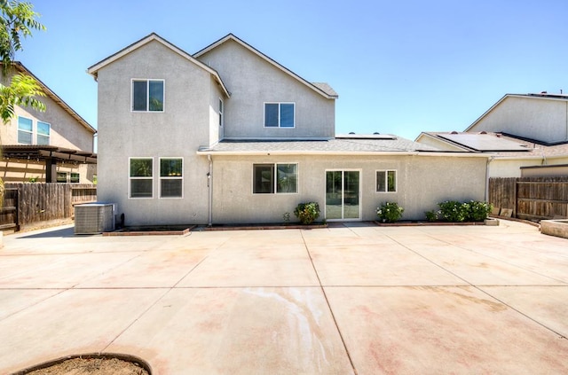 3669 N Clover Ave, Fresno, CA 93727 - rear view of house with a patio, a fenced backyard, and stucco siding