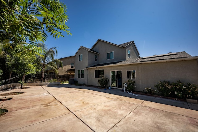 3669 N Clover Ave, Fresno, CA 93727 - rear view of house with stucco siding and a patio