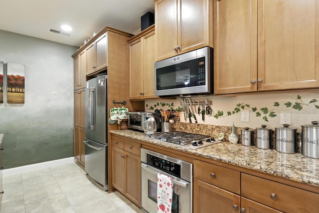 5822 E Booker Ave, Fresno, CA 93727 - kitchen featuring stainless steel appliances and light stone countertops
