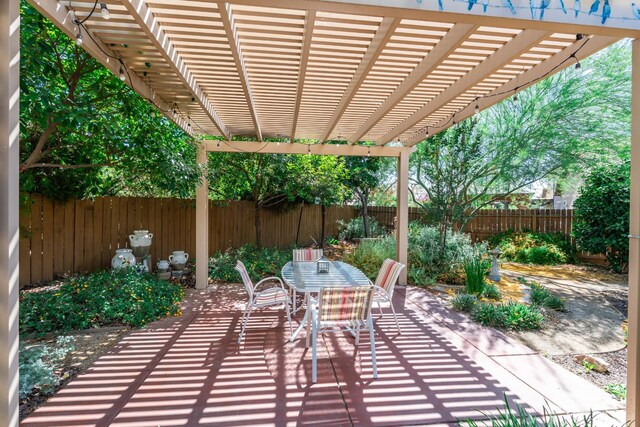 5822 E Booker Ave, Fresno, CA 93727 - fenced backyard with outdoor dining space, a pergola, and a patio